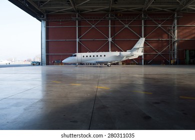 Business Jet Airplane Is In Hangar.