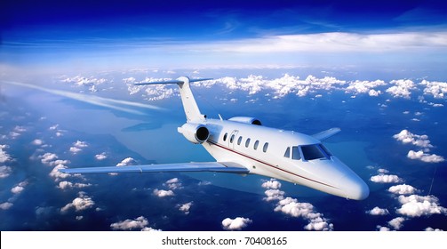 Business Jet Flying Above A Lake