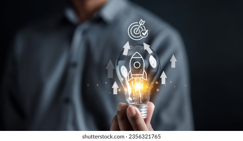 Business journey of a rocket icon inside lightbulb, accelerate towards your goals, rapid startup momentum. sights are set on achieving success, forward with determination and innovation
