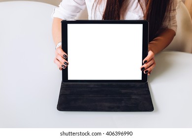 A business lady makes a presentation holding a tablet in front of her, front view mock-up - Shutterstock ID 406396990