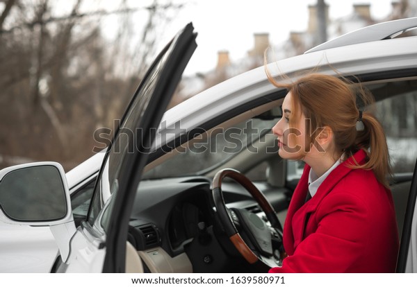 Business lady style, woman with a car, concept\
of modern young lady\
lifestyle