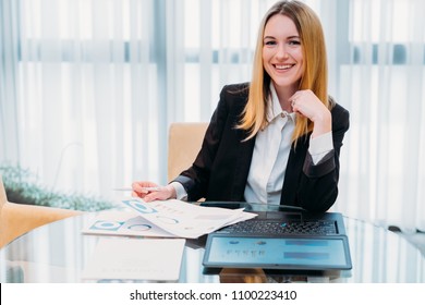business lady at work. company manager. woman looking through documents in office. professional corporate dresscode