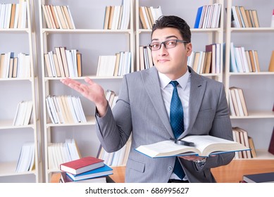 Business Law Student With Magnifying Glass Reading A Book