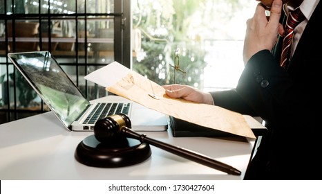 Business And Lawyers Discussing Contract Papers With Brass Scale On Desk In Office. Law, Legal Services, Advice, Justice And Law Concept  Picture With Film Grain Effect