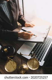 Business And Lawyers Discussing Contract Papers With Brass Scale On Desk In Office. Law, Legal Services, Advice, Justice And Law Concept Picture With Film Grain Effect