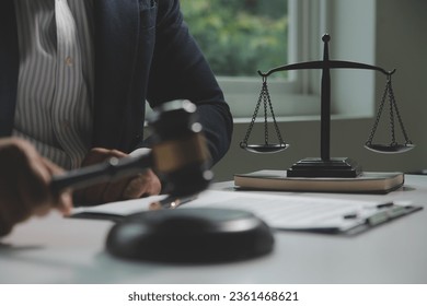 Business and lawyers discussing contract papers with brass scale on desk in office. Law, legal services, advice, justice and law concept picture with film grain effect - Shutterstock ID 2361468621