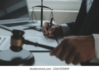Business and lawyers discussing contract papers with brass scale on desk in office. Law, legal services, advice, justice and law concept picture with film grain effect - Shutterstock ID 2361555849