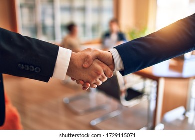 Business Lawyers Workers Meeting At Law Firm Office. Professional Executive Partners Working On Finance Strategry At The Workplace. Shaking Hands For Succesful Agreement.