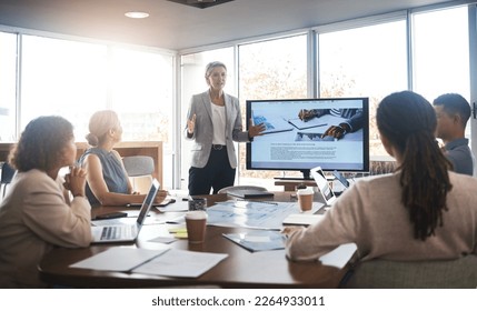 Business leader, woman and slideshow at team building seminar for company growth. Working, market research data and workshop of a female manager meeting with marketing group in office with tech - Powered by Shutterstock