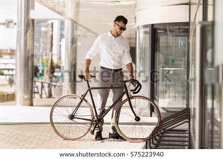 Similar – Image, Stock Photo Young man with bicycle in the sea