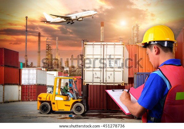 Business logistic concept,\
Foreman control loading Containers box Containers shipping,\
forklift handling container box loading for logistic Import Export\
background