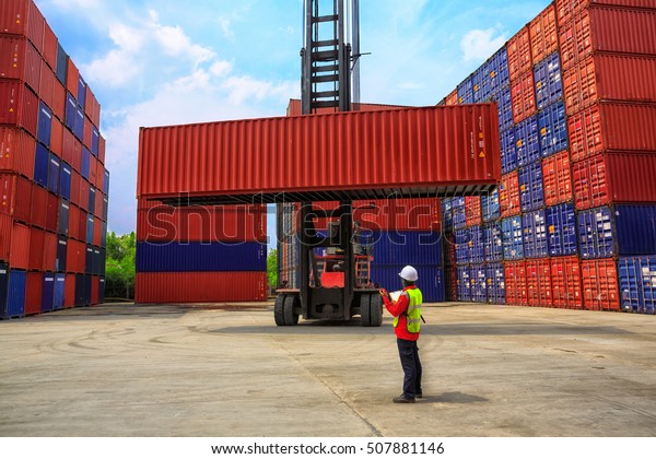 Business logistics concept, Foreman control\
loading Containers box, Container Cargo freight ship for Logistic\
Import Export\
background