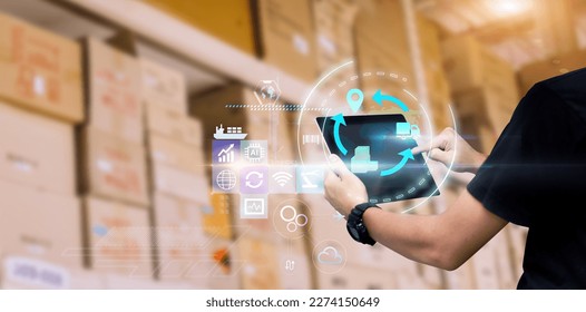 Business Logistics technology concept.Manager hands using tablet on blurred warehouse with full of boxes as background - Shutterstock ID 2274150649