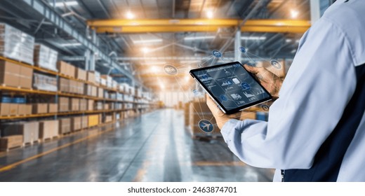 Business Logistics warehouse management system technology concept.Man hands using tablet on blurred warehouse as background - Powered by Shutterstock