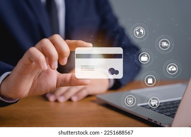 business male holding electronic card and bank card online shopping ,and financial security to expand a comprehensive and modern business, able to conduct transactions through the internet - Shutterstock ID 2251688567