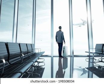 Business Man At Airport With Suitcase