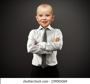 Business Man With Baby Face Over Grey Background