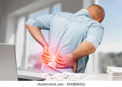 Business Man With Back Pain In Office