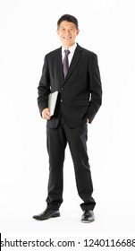 Business Man In Black Suit Standing And Holding Laptop On White Background