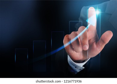 Business man in black suit touching screen