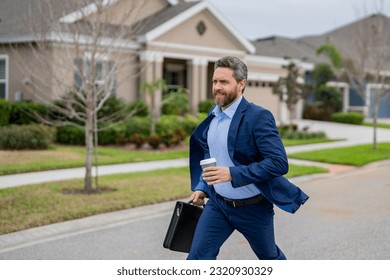 Business man with briefcase and take away coffee run outdoor. Businessman run down street, late meeting. Running business man. Fast business. Run and late business. Manager ceo run from home. - Powered by Shutterstock