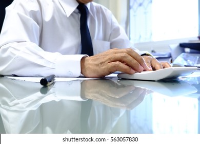 Business man calculating about his work - Shutterstock ID 563057830