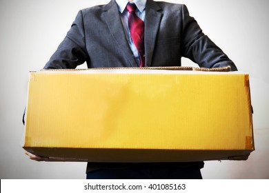 Business Man Carrying An Old Box With Hard Work - Empty Box Ready To Fill In Text - Business Work,debt, Too Much Work And Burden Concept