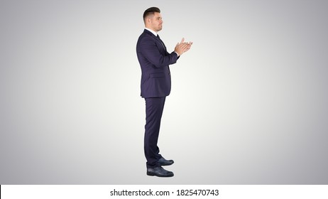 Business Man Clapping Hands On Gradient Background.