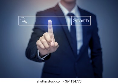business man clicking internet search page on computer touch screen - Shutterstock ID 364134773