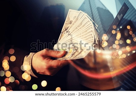 Business Man Displaying a Spread of Cash over a green vintage background