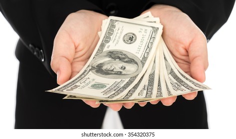 Business man Displaying a Spread of Dollar 