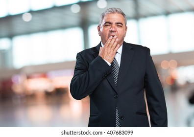 Business Man Doing A Tired Gesture