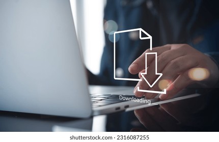 Business man downloading computer files or installing software on laptop computer, cloud storage technology, data backup, cyber security, document downloading