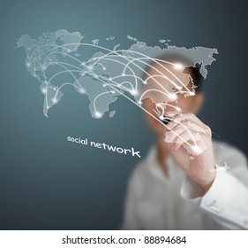 business man drawing social network or business connection with world map on white board