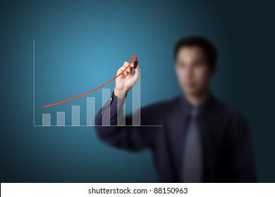 business man drawing upward trend graph on white board