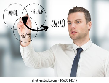 Business man drawing venn diagram doodle in blurry grey office - Powered by Shutterstock