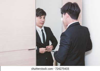 Business Man Dressing Up For Work In Front Of The Mirror In The Departmentstore