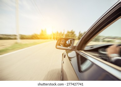 Business Man Driving Fast. Side View Of A Man On His Car. Concept About Car, Transportation, Business, And People