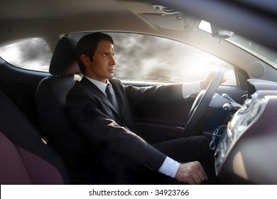 Business Man Driving A Sport Car