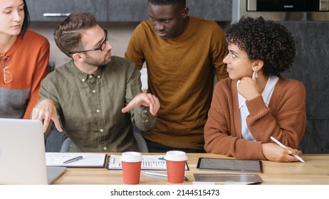 Business Man Explaining Something To His Colleagues .