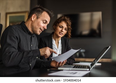 Business Man Explaining Something To Business Woman.