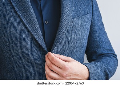 Business Man Fastens A Button On Blue Tweed Blazer With Dark Blue Shirt, Hands Close-up.