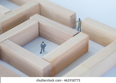 Business Man Figure Stuck In The Middle Of The Maze Or Labyrinth