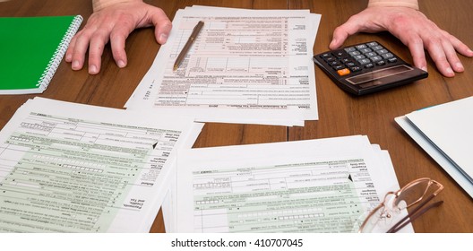 Business Man Filling Out Usa 1040 Tax Form