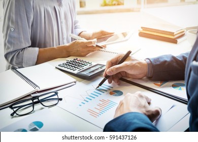 business man financial inspector and secretary making report, calculating or checking balance. Internal Revenue Service inspector checking document. Audit concept - Shutterstock ID 591437126