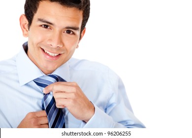 Business man fixing his tie - isolated over a white background