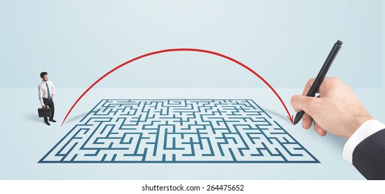 Business man in front of hand drawn maze thinking how to get through