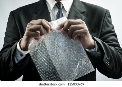 Business Man Funny Relax With Plastic Bubble Wrap