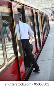 Business Man Getting On Train The Train