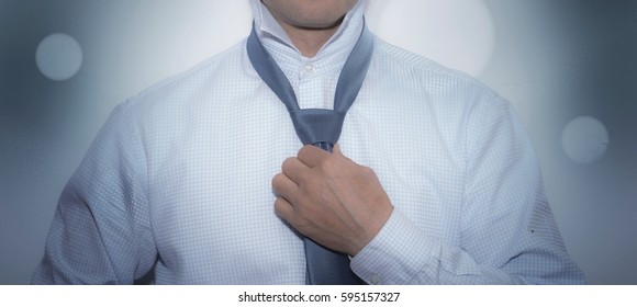 Business Man Getting Ready To Go To Work Wearing A Tie